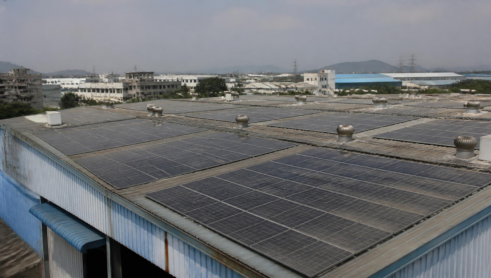 Solar-panel factory rooftop at golden hour